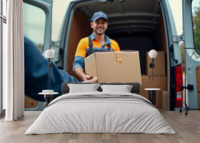 Young Delivery Person in Blue Uniform Holding Cardboard Box Beside Delivery Van Wall mural