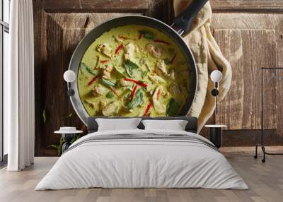 Thai food chicken green curry on wooden background. . Wall mural