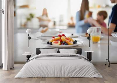 A family preparing breakfast in absolute, a photo focused on the table Wall mural