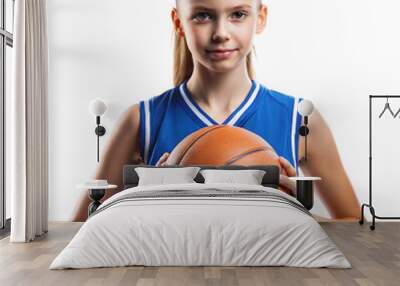 A poised girl in a blue jersey holding a basketball Wall mural