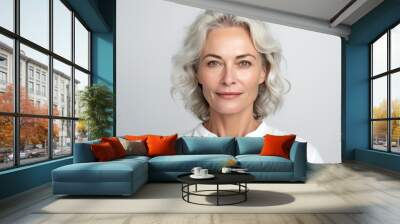 Beautiful mid aged mature woman looking at camera isolated on white. Mature old lady close-up portrait. Generative AI Wall mural