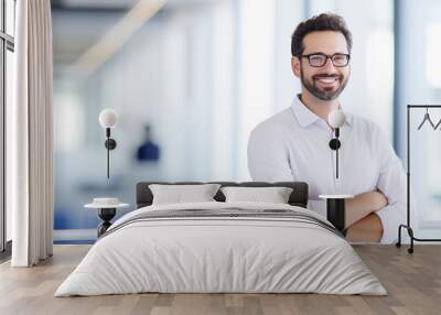 Businessman with glasses and white shirt in office setting. Wall mural