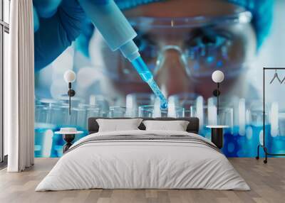 Scientist pipetting blue liquid into test tubes in a high-tech laboratory Wall mural