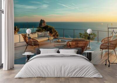 Braided modern garden furniture set on a sea side cliff balcony with a view of the horizon Wall mural