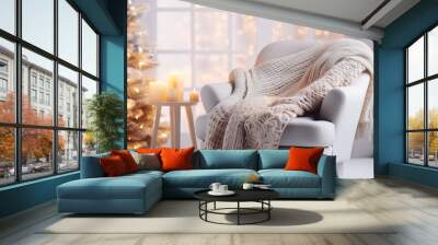 Beautiful holiday decorated room with Christmas tree, fireplace and armchair with blanket. Cozy winter scene. White interior with lights generate ai Wall mural