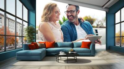 Happy, couple and tablet for online shopping, streaming or reading, social media communication or ecommerce on sofa. Woman, man and relax together on weekend with technology, movie service or network Wall mural