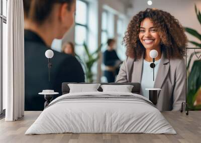 An African American teenage girl experiencing her first job offer, a moment of a handshake with her new manager Wall mural