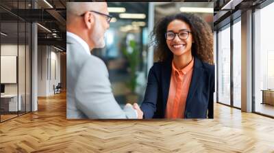 An African American teenage girl experiencing her first job offer, a moment of a handshake with her new manager Wall mural