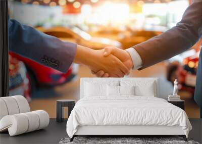 Customer shaking hand with auto insurance agents after agreeing to terms of insurance with blurred car on background Wall mural