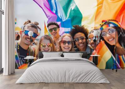 Diverse young group of friends with rainbow flags and banners during Gay Pride event, celebrating gay pride festival - LGBTQ community concept. Wall mural