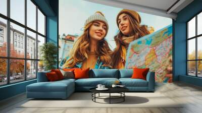 Fun, friends, travel and tourism concept. Beautiful girls looking for direction in the city Wall mural