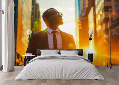 Happy wealthy rich successful black businessman standing in big city modern skyscrapers street on sunset thinking of successful vision, dreaming of new investment opportunities Wall mural