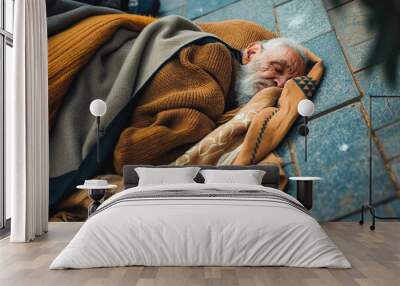 Old homeless man wearing sweater and blanket sleeping on cardboard seeking help because hungry and food beggar from people walking pass on street. Poor man homeless and depression concept Wall mural