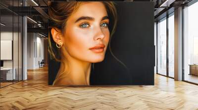 portrait of a beautiful woman with gold earrings on a black background. banner for advertising Wall mural