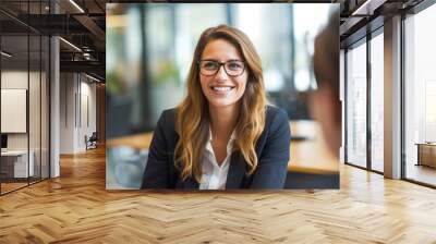 Portrait of successful female business consultant broker adviser meeting with her clients in a modern office setting Wall mural