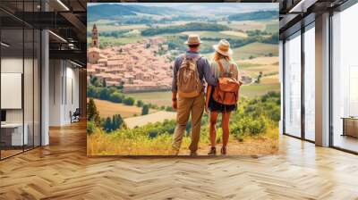 Tuscany, Italy travel destination. Tourist couple on sunny day looking at beautiful landscape and distant villages. Generative AI. Wall mural