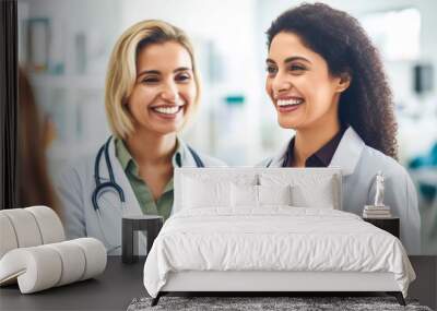 Two Female doctors with clipboard talking to smiling woman patient at hospital Wall mural