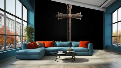 Christian religious metal cross on black background. Christian religious crucifix on black background. Topics related to the Christian religion. Topics related to death. Object of worship and belief. Wall mural