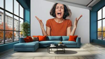 Close up shot of screaming crazy frustrated woman with anxiety, anger and depression. Very upset and emotional woman crying. Young girl with angry and furious face. Human expressions and emotions Wall mural