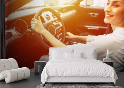 Cropped photo of young woman driving a car Wall mural