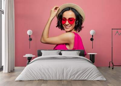 Females holidays. Beautiful trendy happy glamorous young woman in fashion wears and cool glasses in pink vivid style. Wall mural