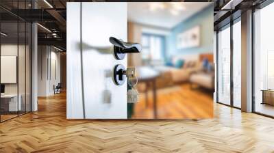 Open door with keys, key in keyhole Wall mural