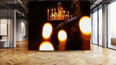 church candles in temple, faith and religion for Christians and Catholics. light in dark for prayer and meditation, spiritual development and improvement. Wall mural