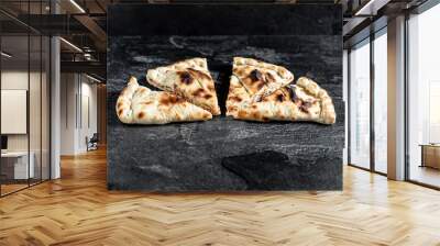 tasty italian calzone pizza with fresh ingredients and vegetables Wall mural