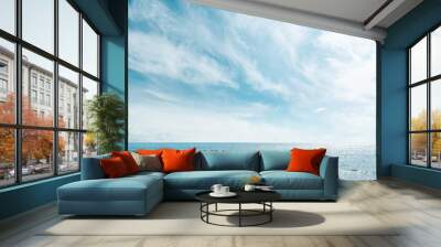 blue sea and cloudy sky over it Wall mural