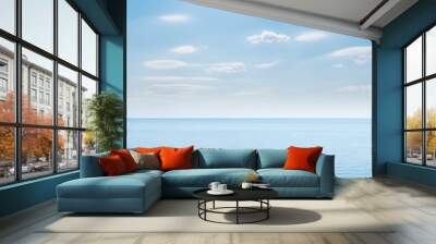 blue sea and cloudy sky over it Wall mural