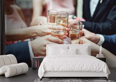 People hold in hands glasses with white wine. wedding party. Wall mural