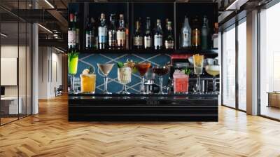 row of various colourfull alcoholic cocktails on a bar desk. Glasses of differen shapes Wall mural