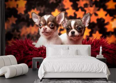 Two small dogs lie on a shaggy red pillow Wall mural