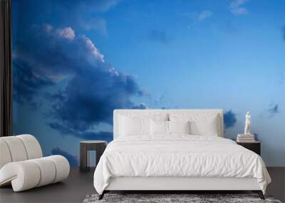 Abstract blue sky, yellow, red, orange clouds empty background Wall mural