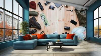 Creative arrangement of travel photography equipment on light raw wooden planks background Wall mural