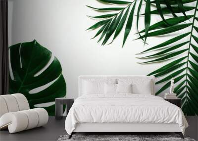 Green flat lay tropical palm leaf branches on white background. Room for text, copy, lettering. Wall mural