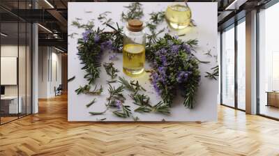 rosemary plant and rosemary oil in bottles Wall mural