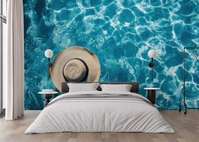 A swimmer enjoying summer sunbathing in the pool wearing a dip hat in a vibrant abstract graphic top view object capture Wall mural