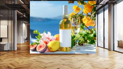 White wine in glass bottle with blank label, fruits and flowers on the background of the Mediterranean landscape  Wall mural