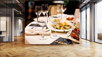 empty wine glasses on a served table in a fancy restaurant Wall mural