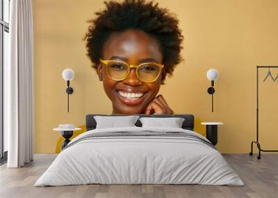 smiling african woman with glasses on blue background Wall mural