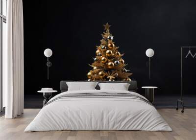 Gold Christmas Tree decorated with baubles against a black background Wall mural