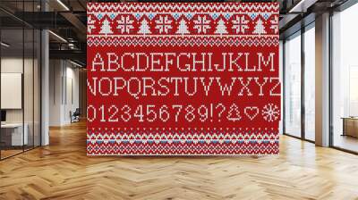 Christmas font. Knitted latin alphabet on seamless knitted pattern with snowflakes and fir. Nordic fair isle knitting, winter holiday sweater design. Vector Illustration. Wall mural