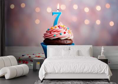 Birthday cupcake with lit birthday candle Number seven for seven years or seventh anniversary Wall mural