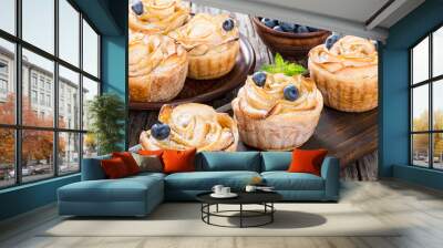 apple rose cake or cupcake and blueberry, side view Wall mural