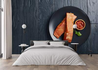 baked salmon fillet on a black plate Wall mural