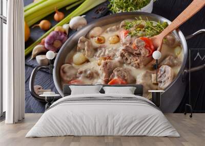 creamy veal stew in a pot, top view Wall mural