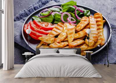 grilled chicken strips on a plate with vegetables Wall mural