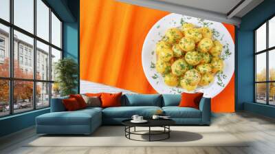 hot new potatoes on white plate Wall mural