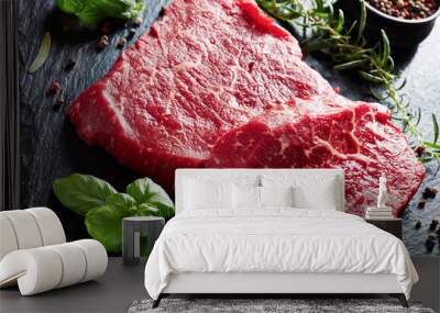 raw beef steaks on a black slate tray Wall mural